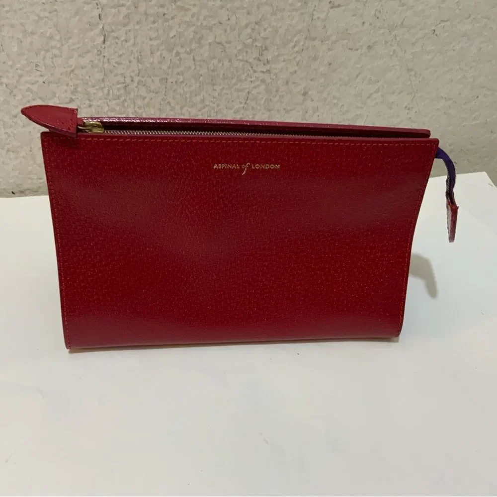 NWOT Aspinal of London red reptile cosmetic case.